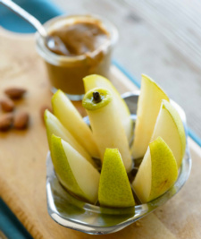 Sliced pear wedges with nut butter for dipping