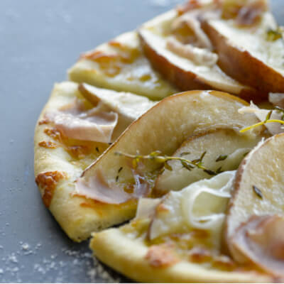 Savory pear and prosciutto pizza