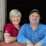 Jon and Debra Laraway in the doorway to their iconic red barn